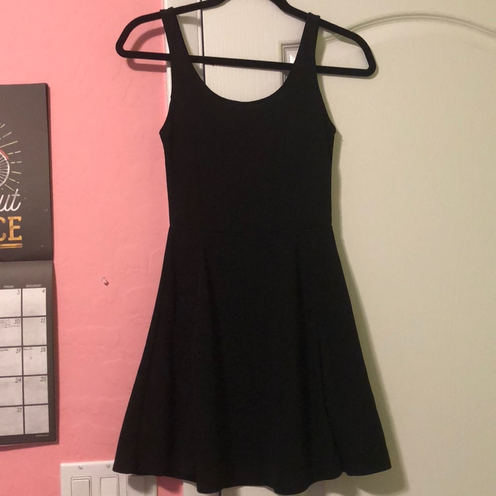 A black scoop neck dress